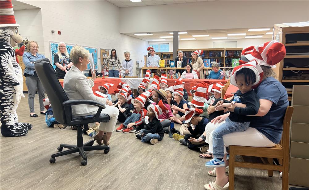 Students, staff, and administrators enjoying story time during the annual Read Across America event.